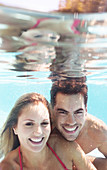 Couple smiling in swimming pool