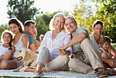 Family relaxing together in backyard