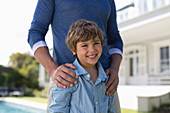 Father and son standing outdoors