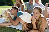 Family relaxing in backyard