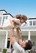 Father and daughter playing outdoors