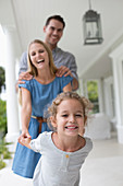 Family playing together on porch