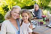 Older woman and granddaughter smiling