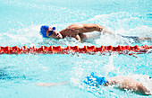 Swimmers racing in pool