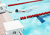 Swimmer touching edge of pool