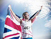 Track and field athlete holding flag
