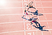 Runners crossing finish line on track