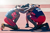 Runners huddled on track