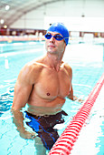 Swimmer standing in pool