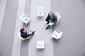 Businessman and businesswoman talking