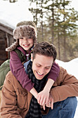 Portrait of happy son hugging father