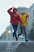 Happy couple in raincoats