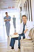 Serious doctor in hospital corridor
