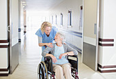 Nurse with aging patient in wheelchair