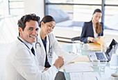 Portrait of smiling doctor in meeting