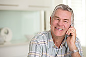 Senior man talking on telephone
