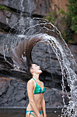 Woman flipping hair in water
