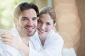 Portrait of smiling couple in bathrobes