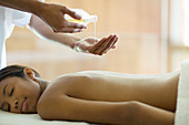 Woman receiving massage at spa