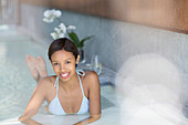 Woman relaxing in spa pool