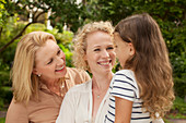 Three generations of women smiling