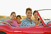 Family in convertible together