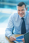 Businessman smiling at desk