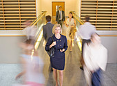 Businesswoman walking in corridor