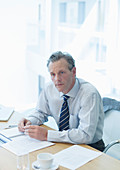 Businessman sitting at desk in office