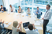 Business people clapping in meeting