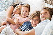 Family relaxing together on sofa