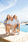 Grandfather and grandchildren smiling