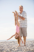 Older man playing with granddaughter