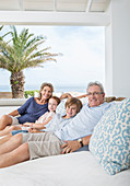 Older couple with grandchildren on sofa