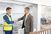 Supervisor and worker shaking hands