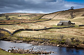 River and pastures in rural landscape