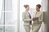 Businesswomen using tablet in office