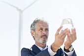 Businessman holding glass of water