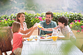 Family at table in garden