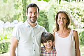 Family smiling together outdoors