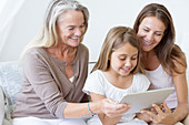 Multi-generation women using tablet