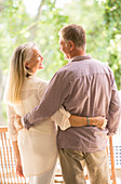 Senior couple hugging on patio