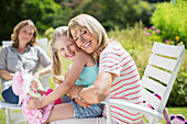 Grandmother and granddaughter hugging