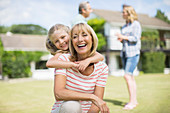 Grandmother and granddaughter hugging