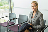 Businesswoman sitting in waiting area