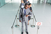 Businessman waiting in line