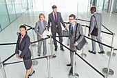 Business people in roped-off area