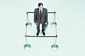 Businessman standing in roped-off square