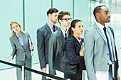 Business people waiting in line