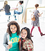 University students smiling in lounge